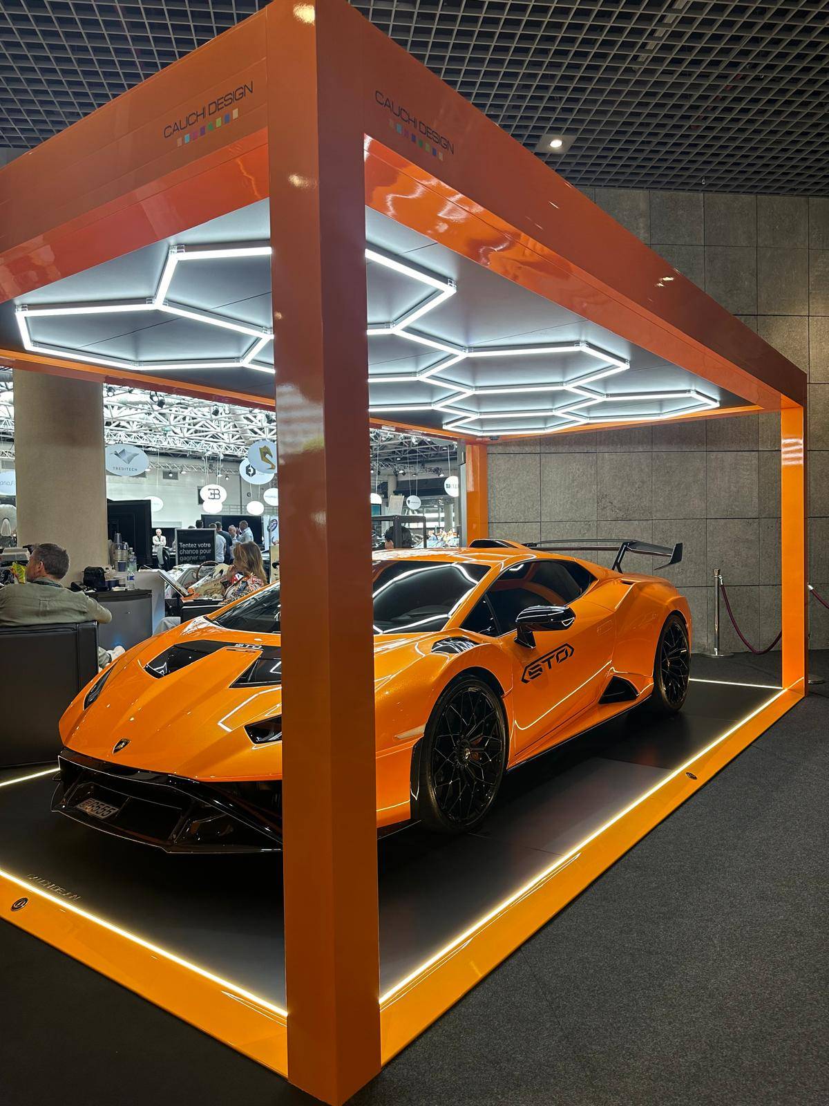La Lamborghini STO orange de GMK à Top Marques Monaco 2024: Exposition sous le Carport de Cauchi Design